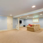 A refinished basement with new flooring.