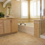 A remodeled bathroom with a new vanity and bathtub.