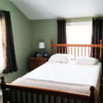 A remodeled bedroom with new drywall walls.
